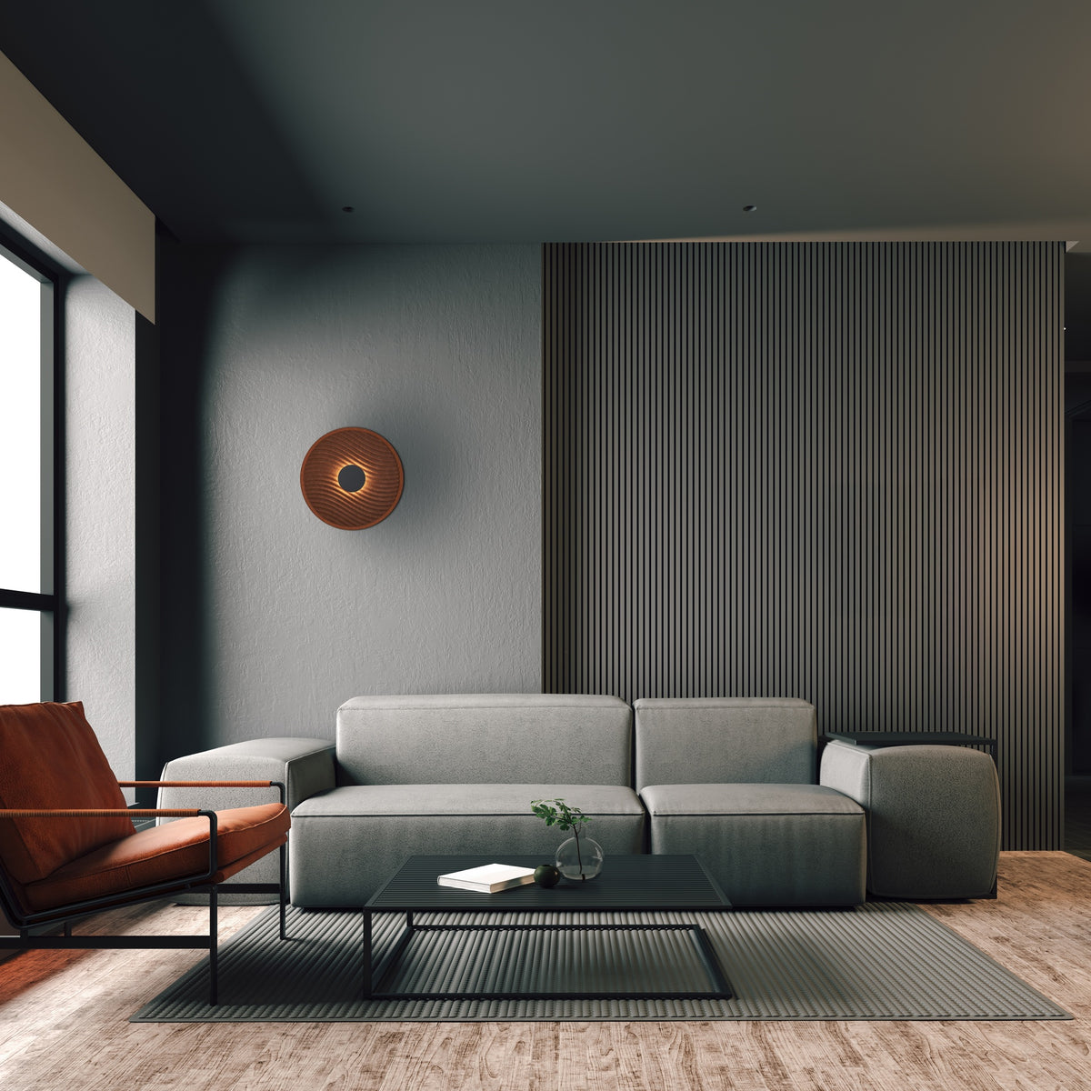 Mise en ambiance dans un salon contemporain, applique ronde fixée au mur gris.