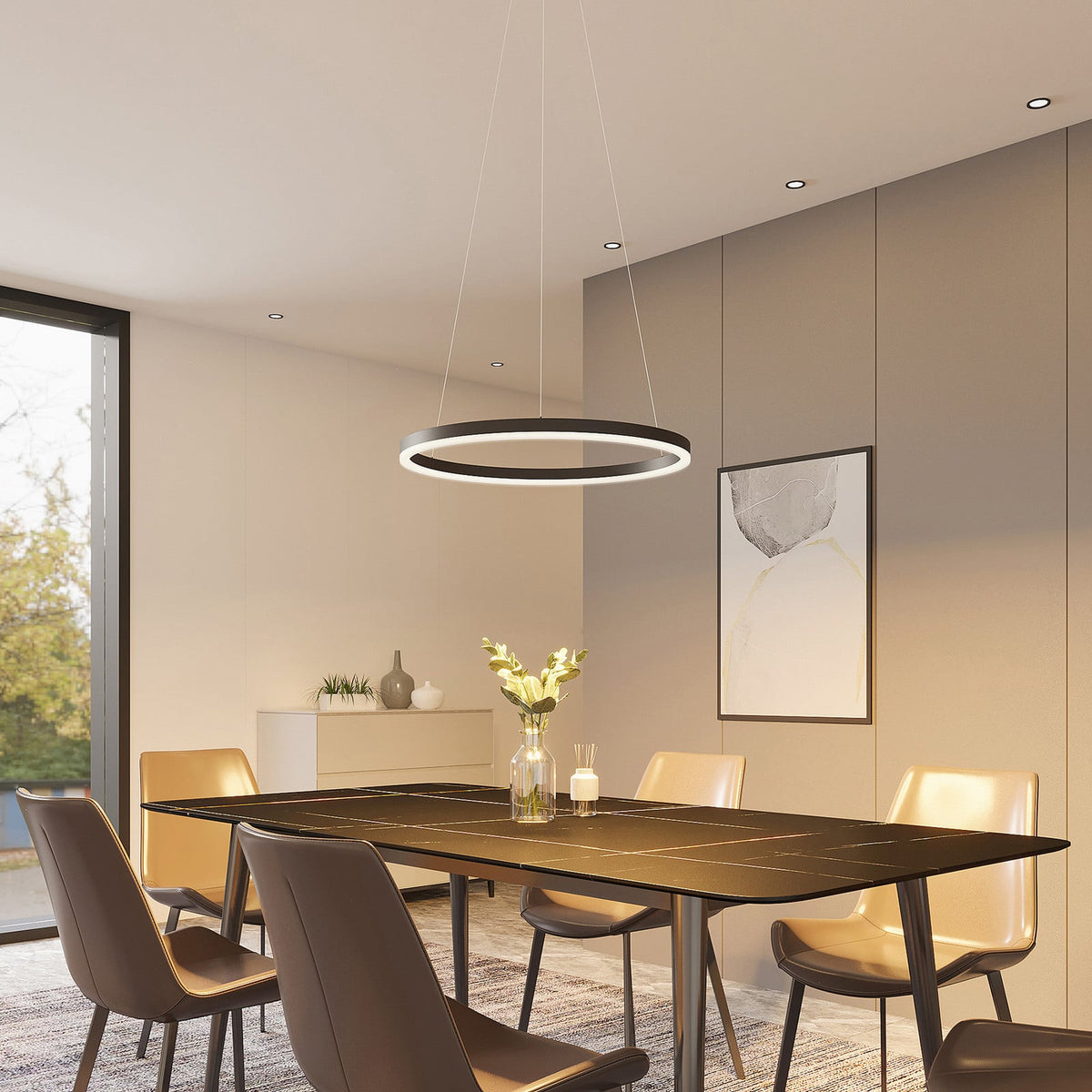 Salle à manger moderne avec grande table noire et suspension circulaire au-dessus