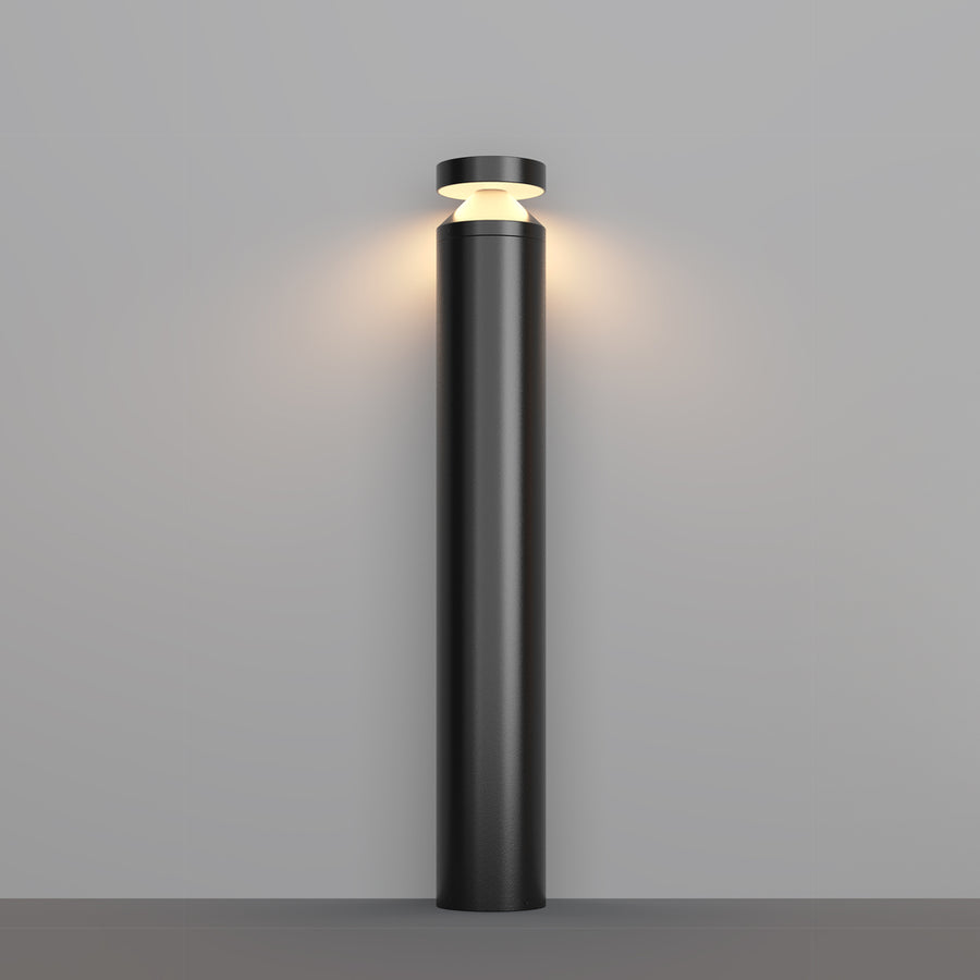 Borne lumineuse noire cylindrique de face sur fond gris clair uni