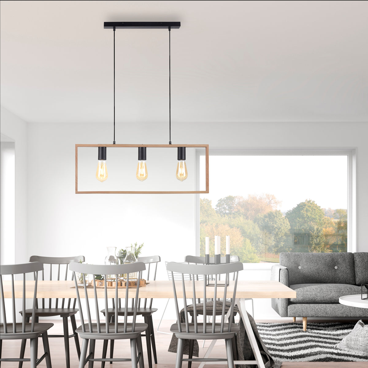 Mise en ambiance au-dessus d'une table à manger dans un intérieur clair et moderne.