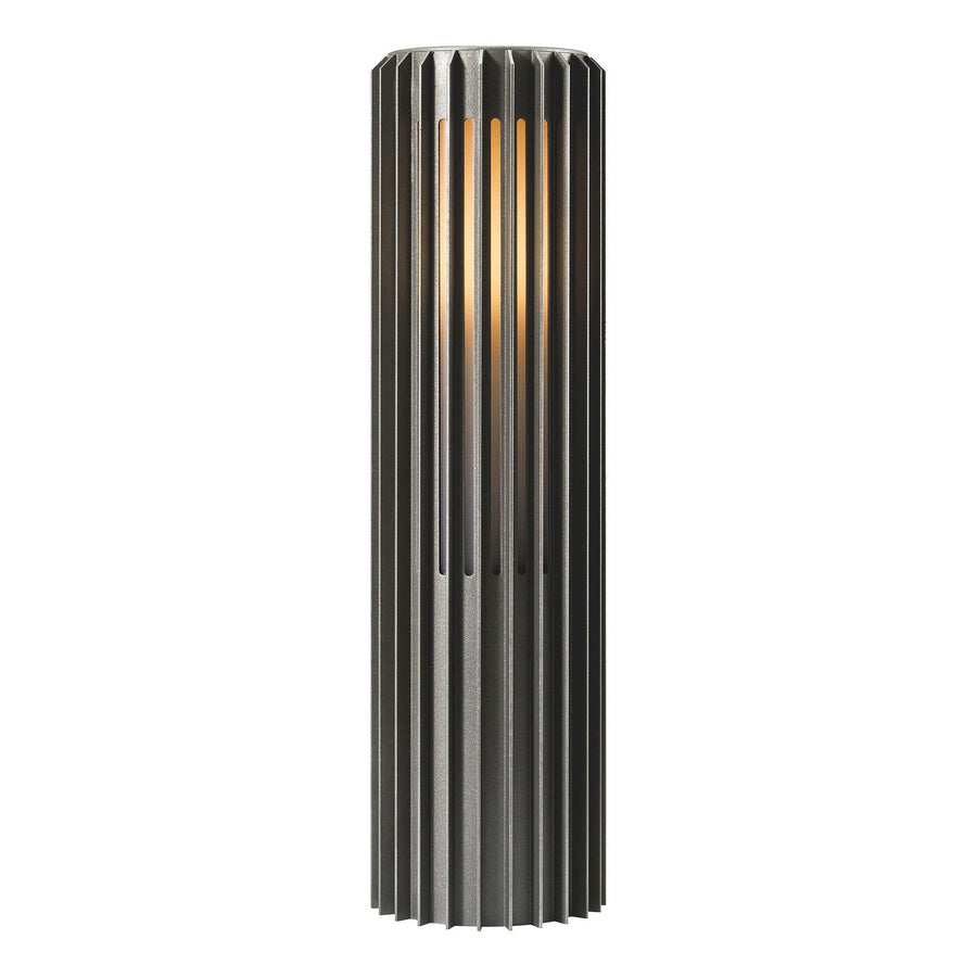Borne extérieure cylindrique noire à nervures verticales, lumière chaude, vue de face sur fond blanc.