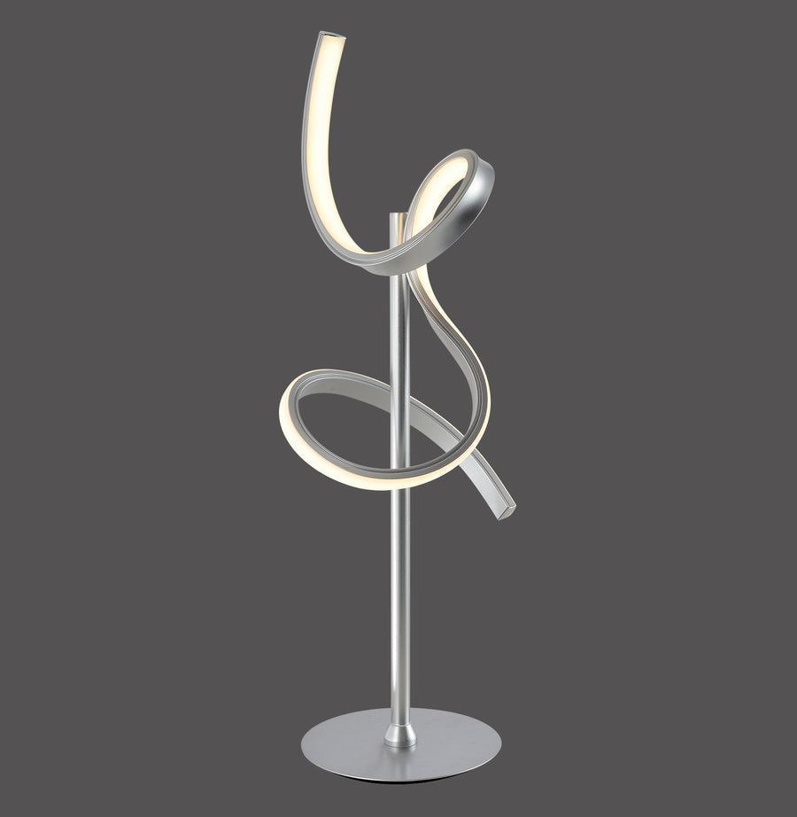 Lampe à poser argentée vue de face sur fond gris anthracite, ruban LED spiralé