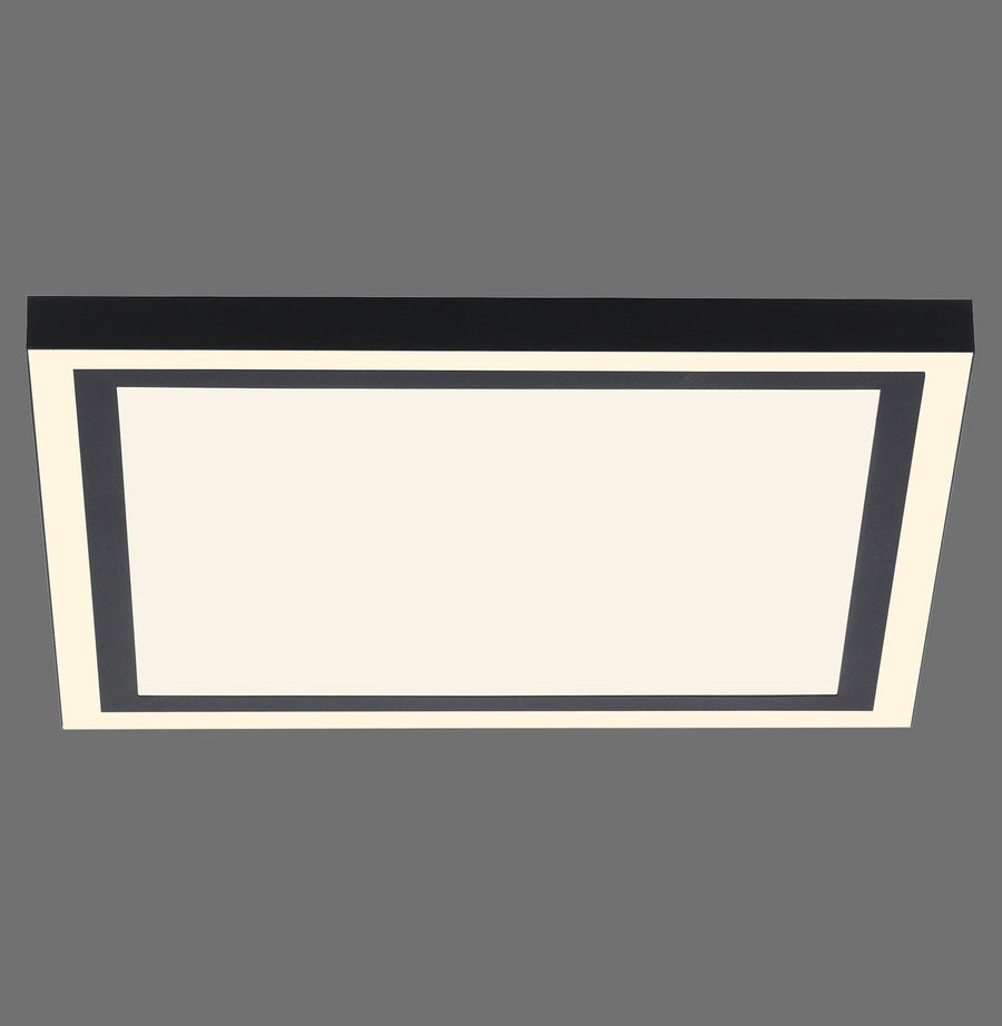 Luminaire rectangulaire noir et blanc vu de face sur fond gris neutre