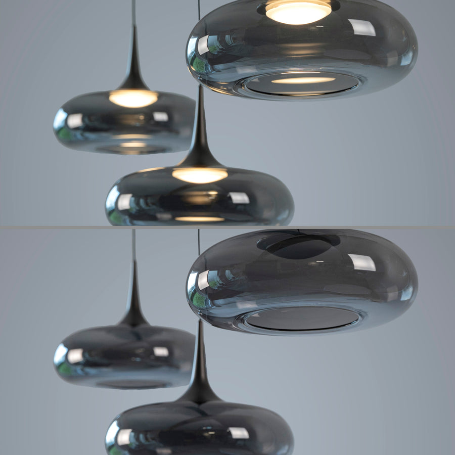 Gros plan sur les abat-jours en verre fumé et la lumière chaude des LED