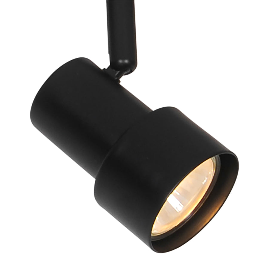 Gros plan sur un spot cylindrique noir et son articulation réglable, finition mate