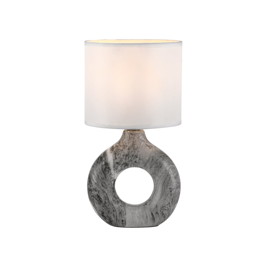 Vue de face sur fond blanc, lampe complète avec abat-jour cylindrique et socle ajouré