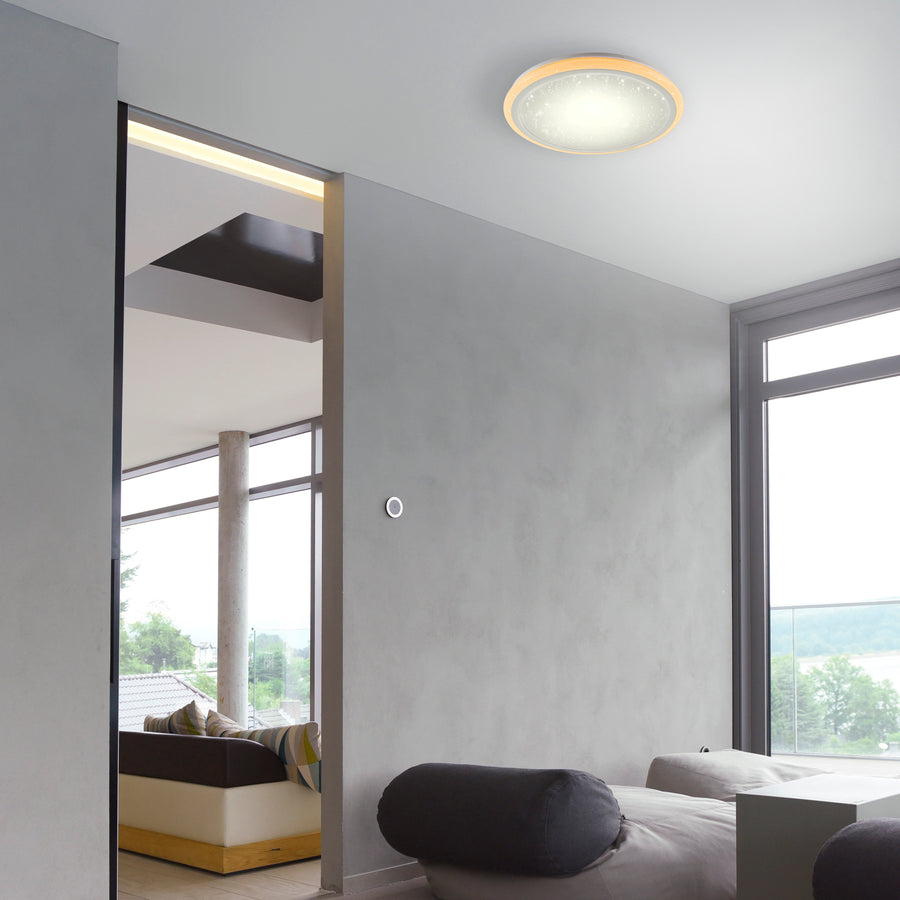 Plafonnier blanc installé au plafond d'un salon contemporain lumineux