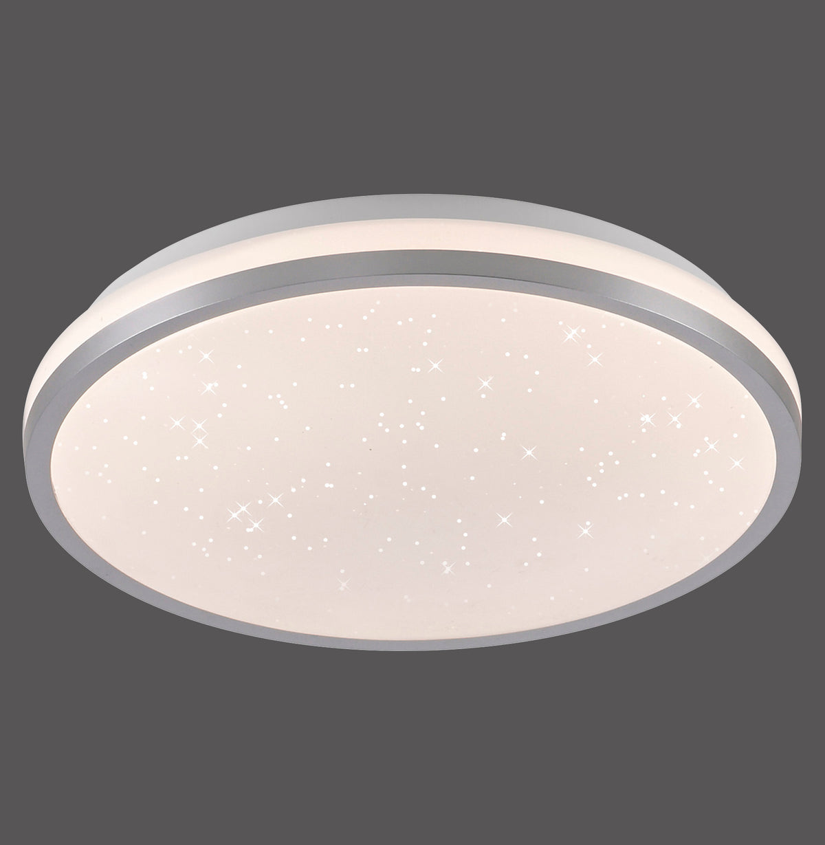 Plafonnier rond argenté au diffuseur étoilé, vu de face sur fond gris