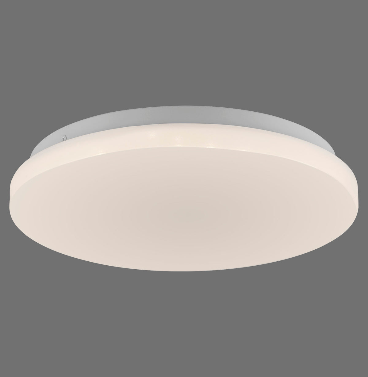 Vue de dessous du plafonnier rond blanc sur fond gris uni