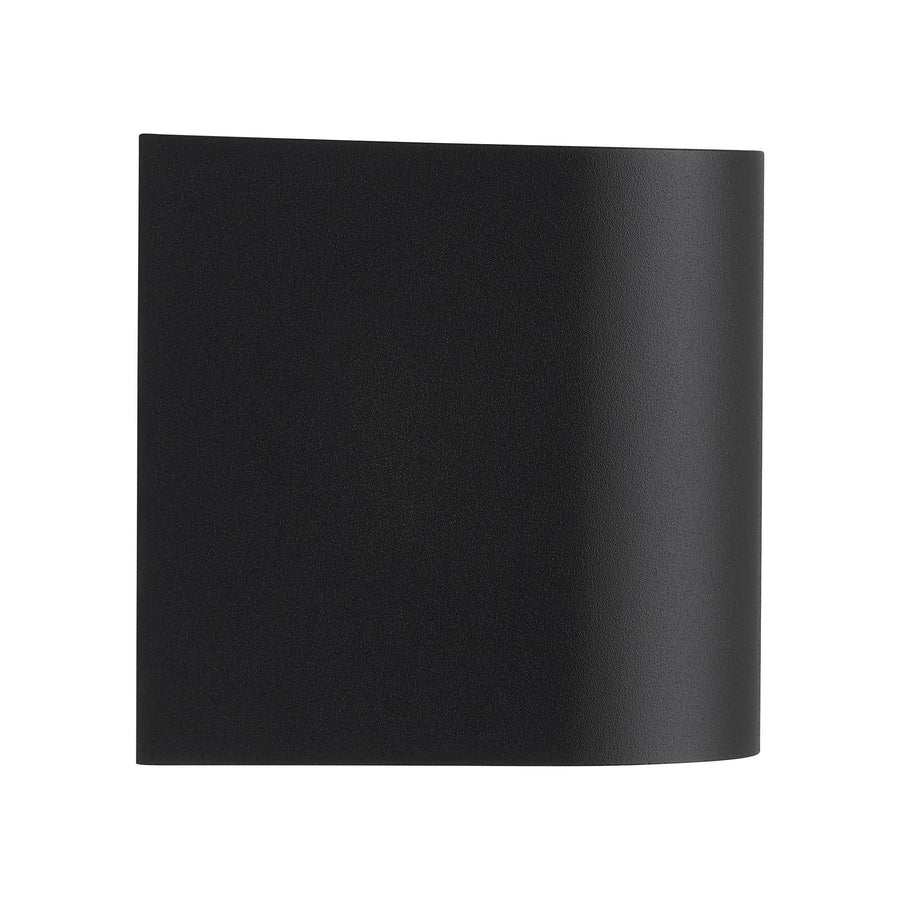 Profil avant de l'applique murale noire, forme galbée et finition texturée.