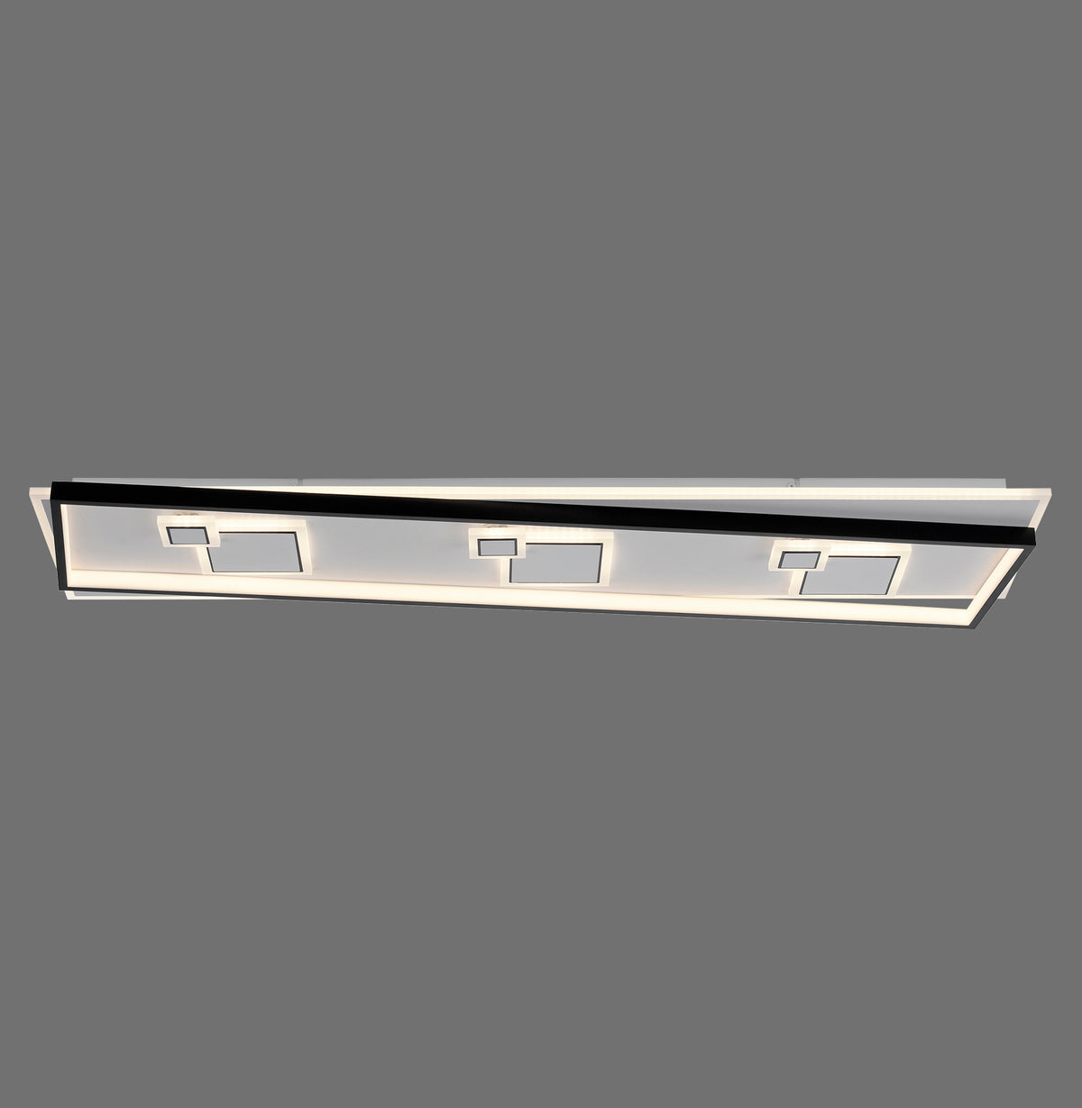 Plafonnier rectangulaire noir et blanc vu de face, LED allumées sur fond gris