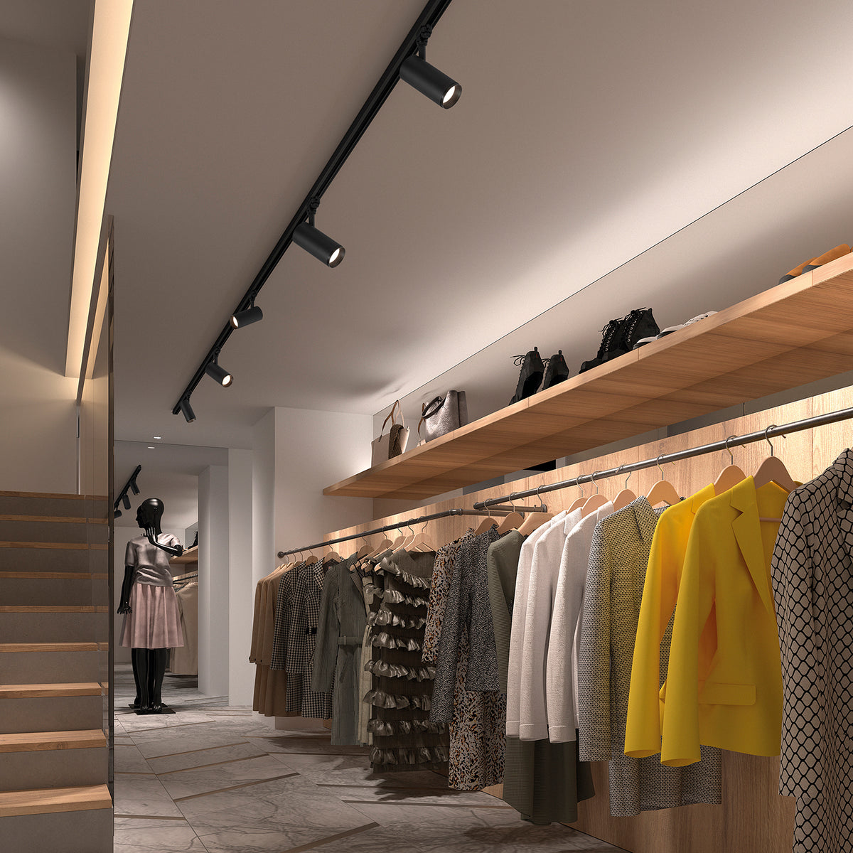 Mise en ambiance dans une boutique de vêtements avec plusieurs spots noirs sur rail.