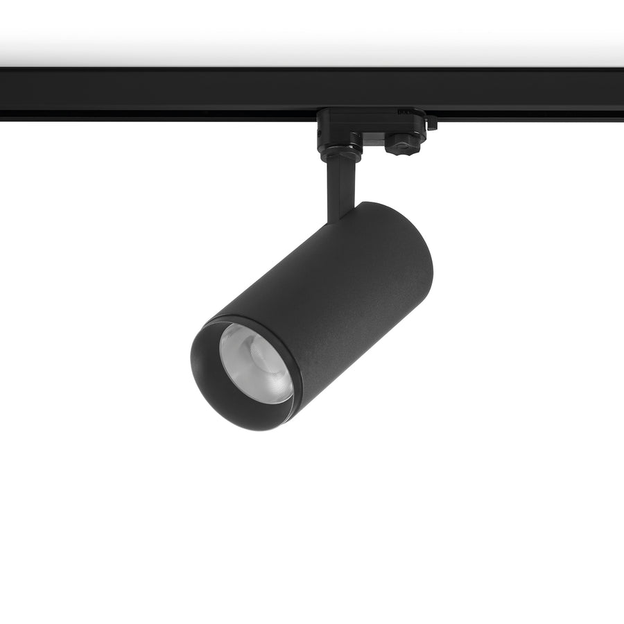 Version noire du spot sur rail, orientable, avec optique LED apparente.