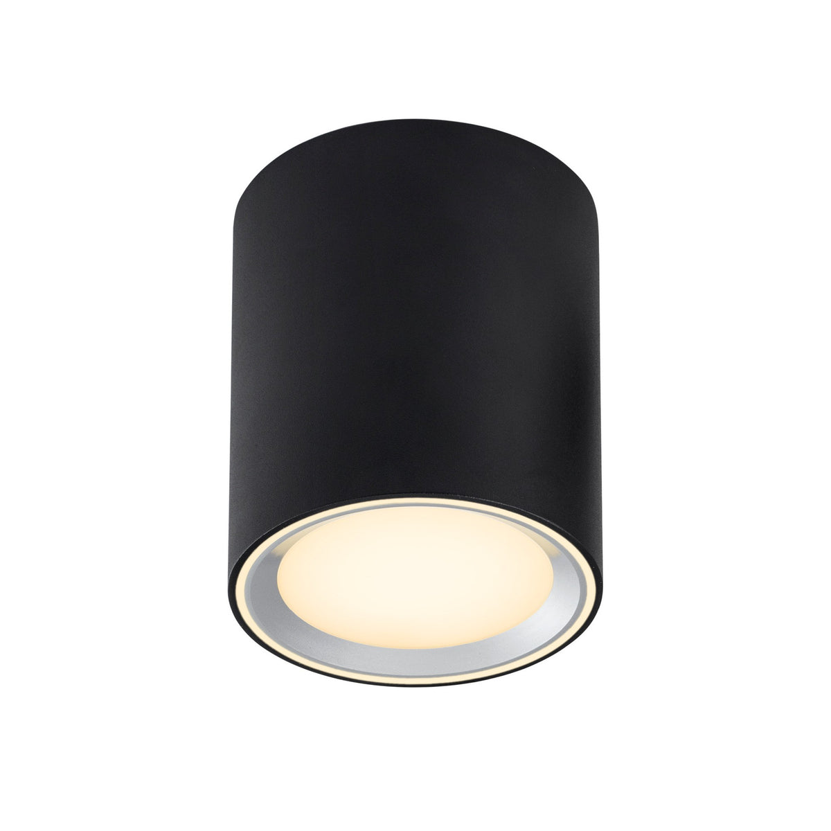 Spot cylindrique noir allumé, fixé au plafond, lumière chaude vers le bas.