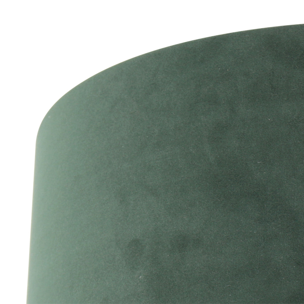 Gros plan sur le bord supérieur et la texture veloutée du tissu vert