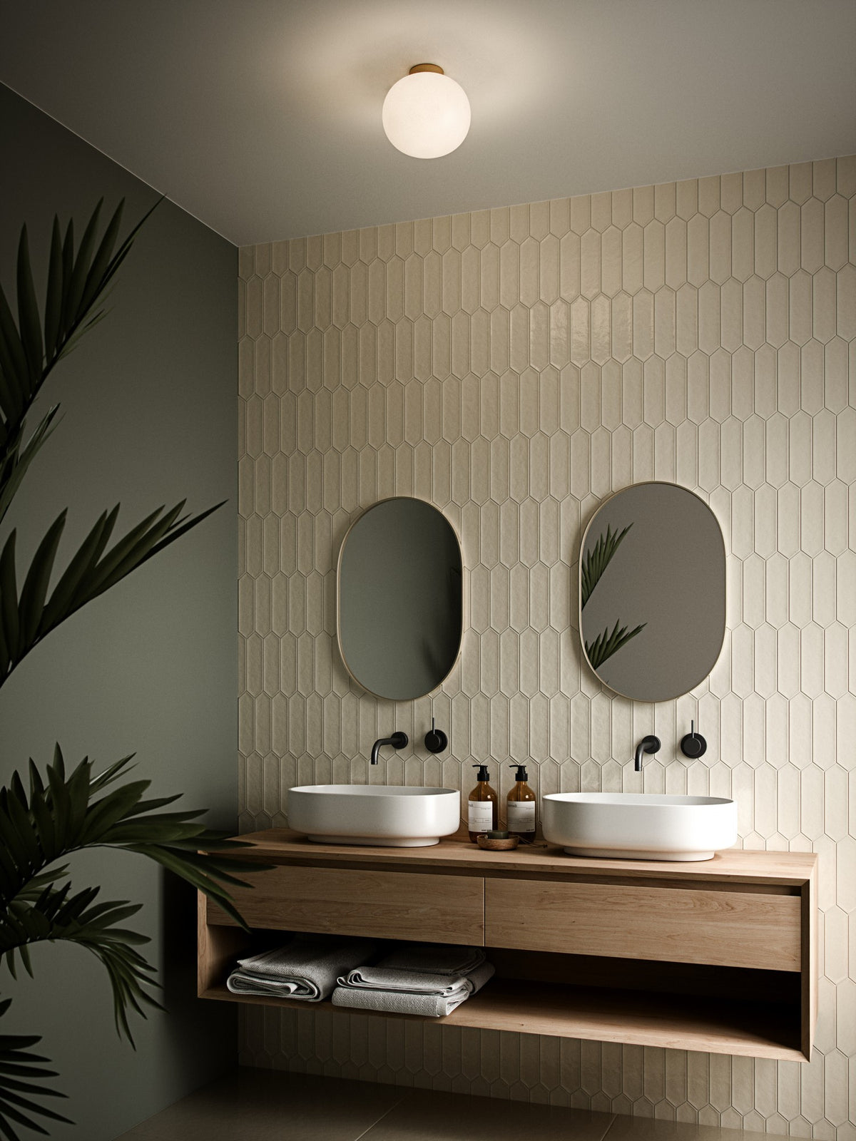 Mise en ambiance d'une salle de bain où le plafonnier éclaire deux vasques et miroirs.