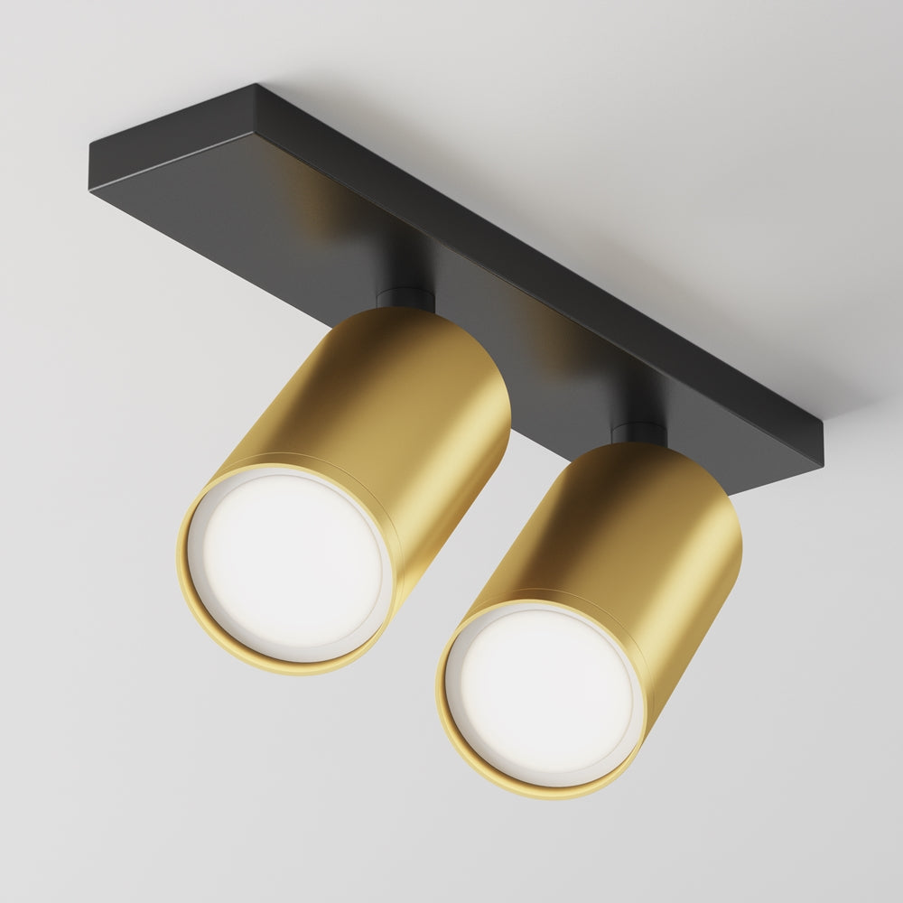 Plafonnier deux spots dorés orientables montés sur une embase rectangulaire noire