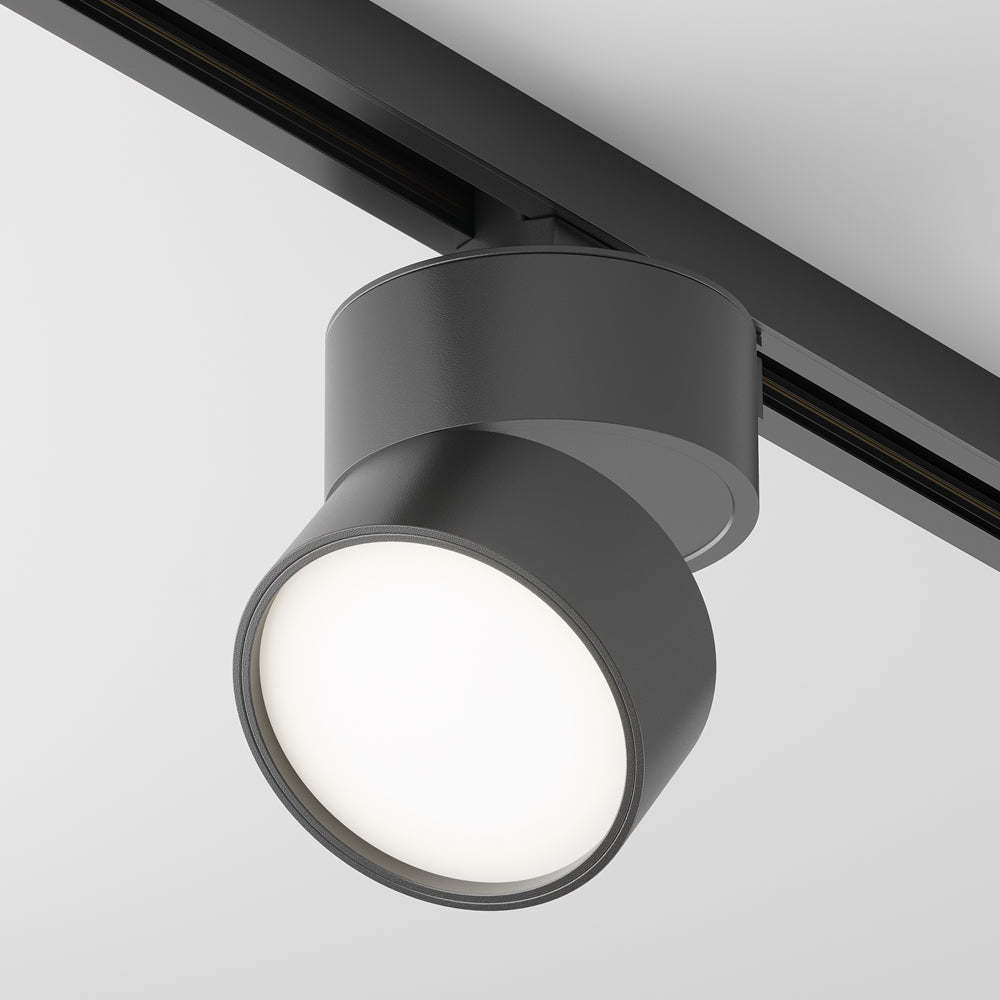 Spot noir sur rail de plafond, corps cylindrique orienté vers le bas, produit de face