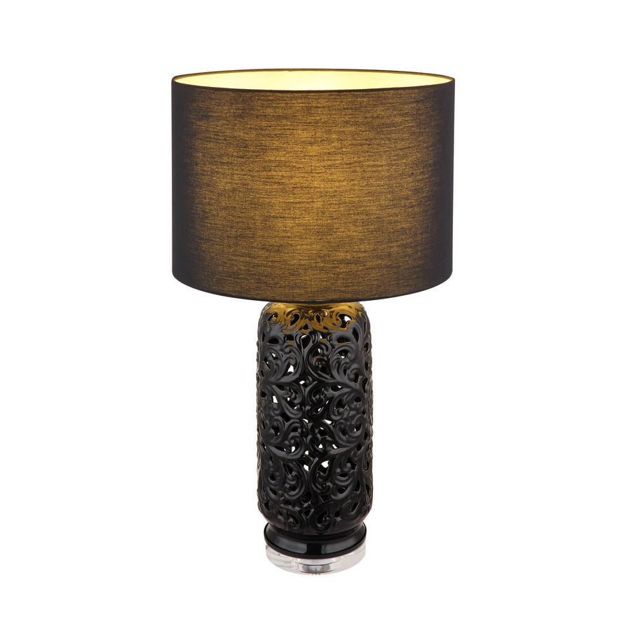 Lampe à poser de face, abat-jour textile noir doublé or, socle cylindrique ajouré noir mat
