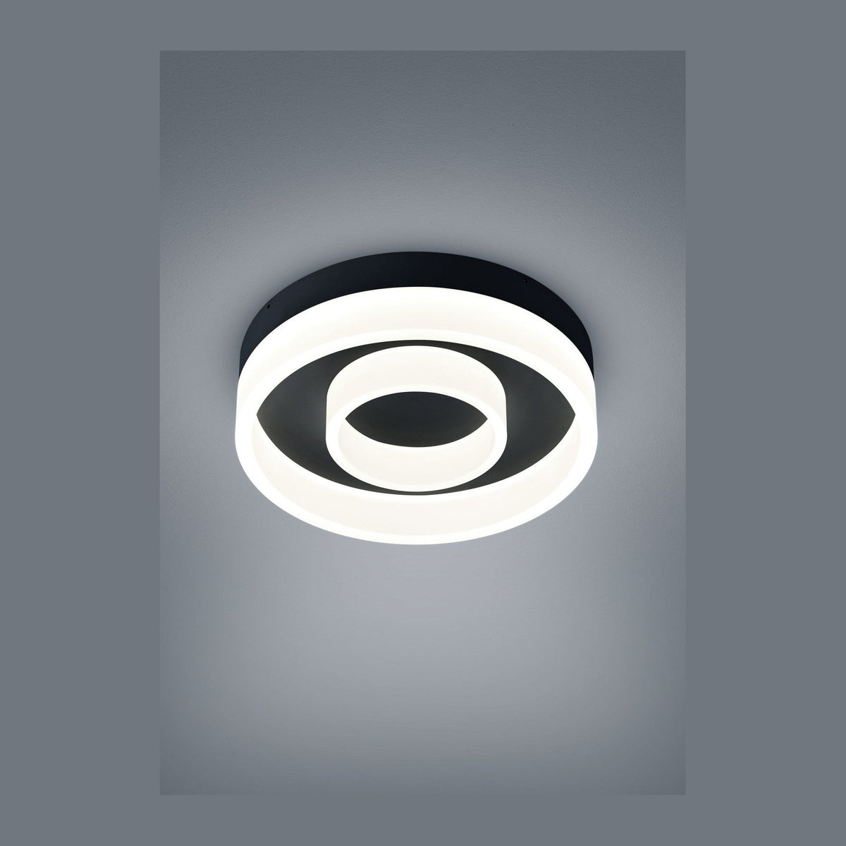 Plafonnier rond noir vu de dessus, anneau lumineux LED blanc en spirale