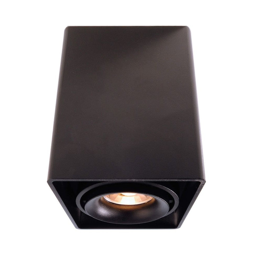 Spot noir rectangulaire vu de trois quarts, réflecteur rond et ampoule allumée.