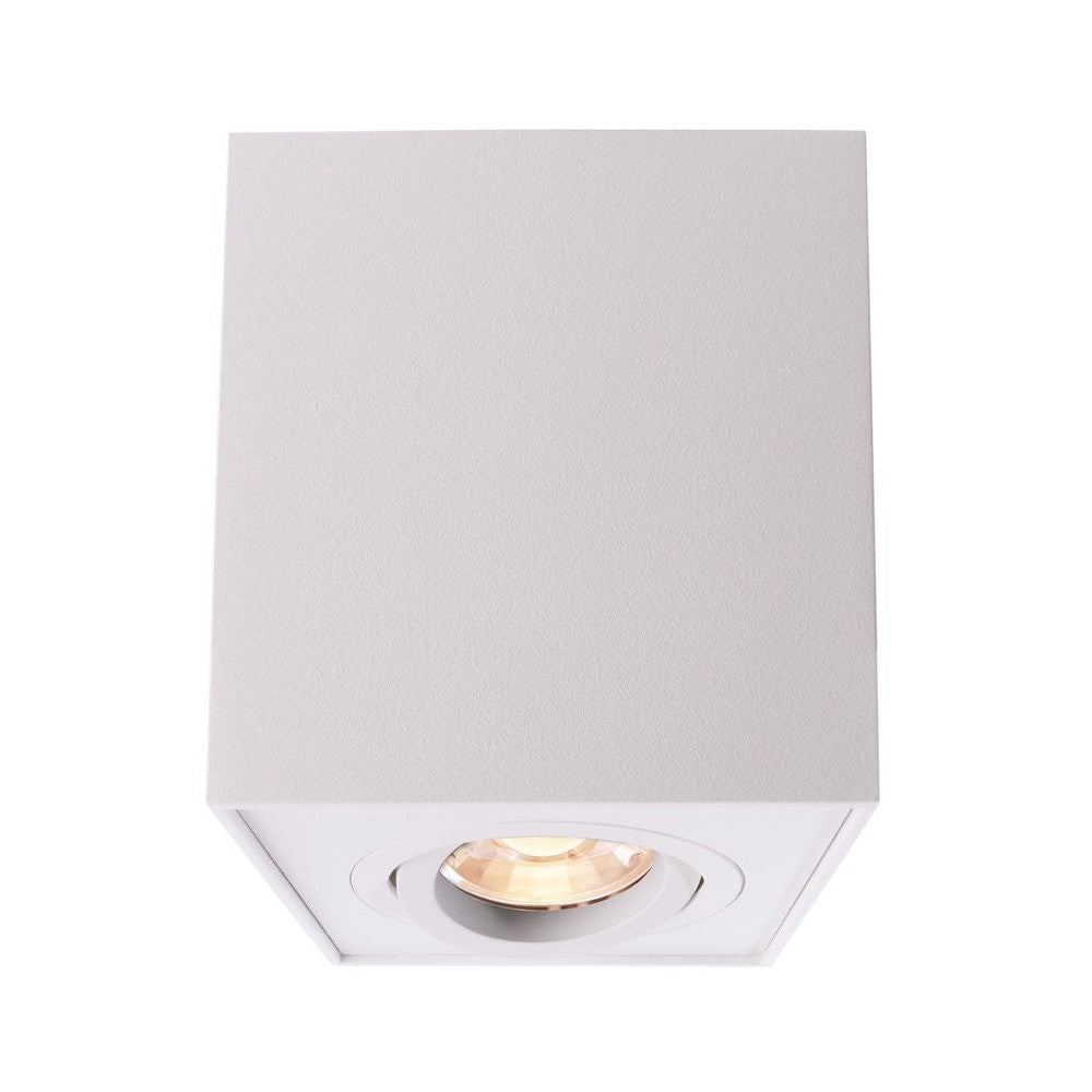 Spot cubique blanc de face avec son ouverture ronde et ampoule LED intégrée.