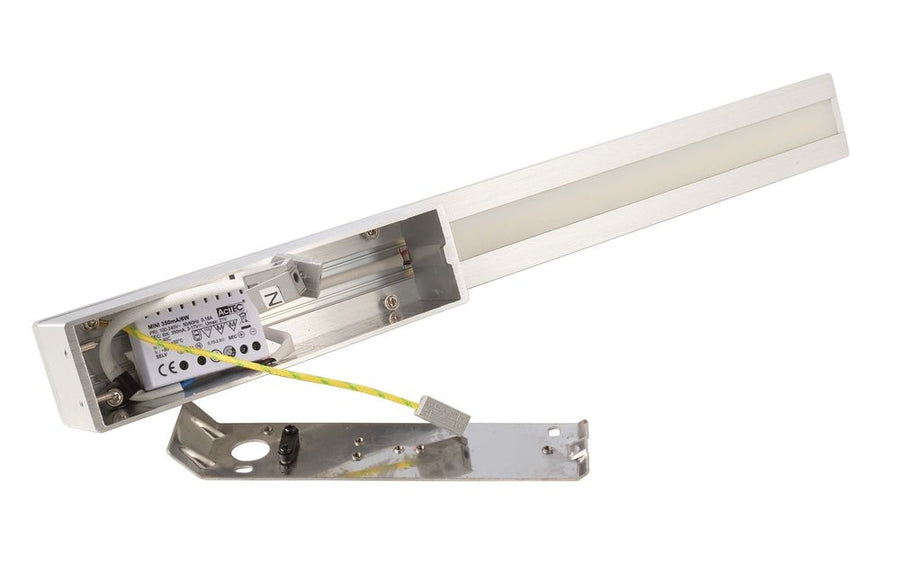Détail du boîtier ouvert avec driver LED, câblage et platine de fixation métallique.