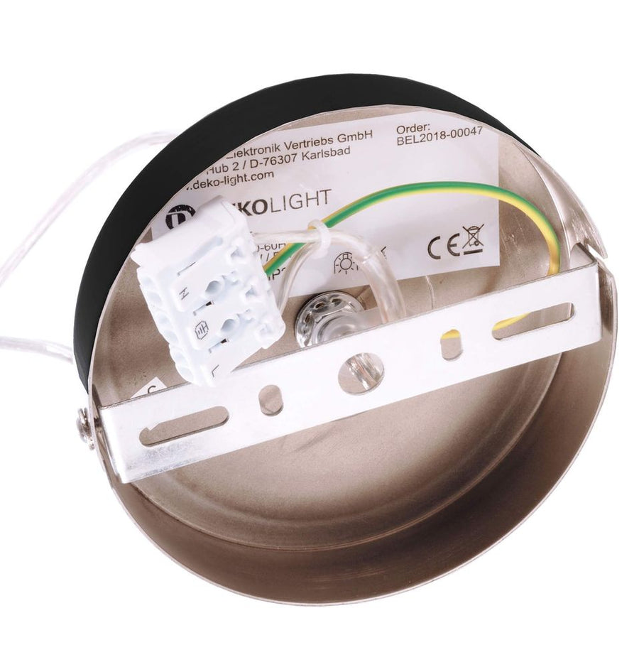 Détail du boîtier de fixation métallique et du bornier électrique du luminaire.