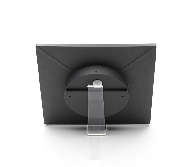 Vue arrière : boîtier gris, driver central rond et support transparent de présentation.