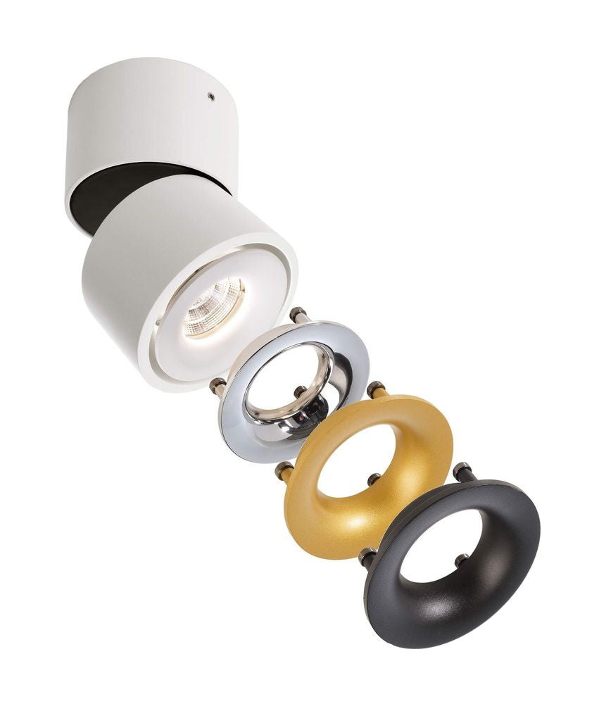 Spot blanc accompagné de trois anneaux décoratifs interchangeables argent, doré et noir