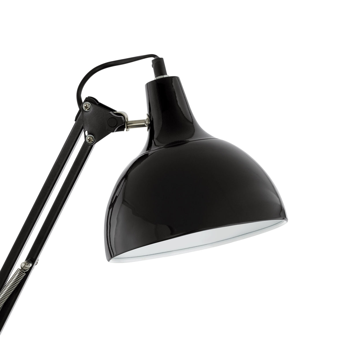 Gros plan sur l'abat-jour noir brillant et l'articulation métallique de la lampe.