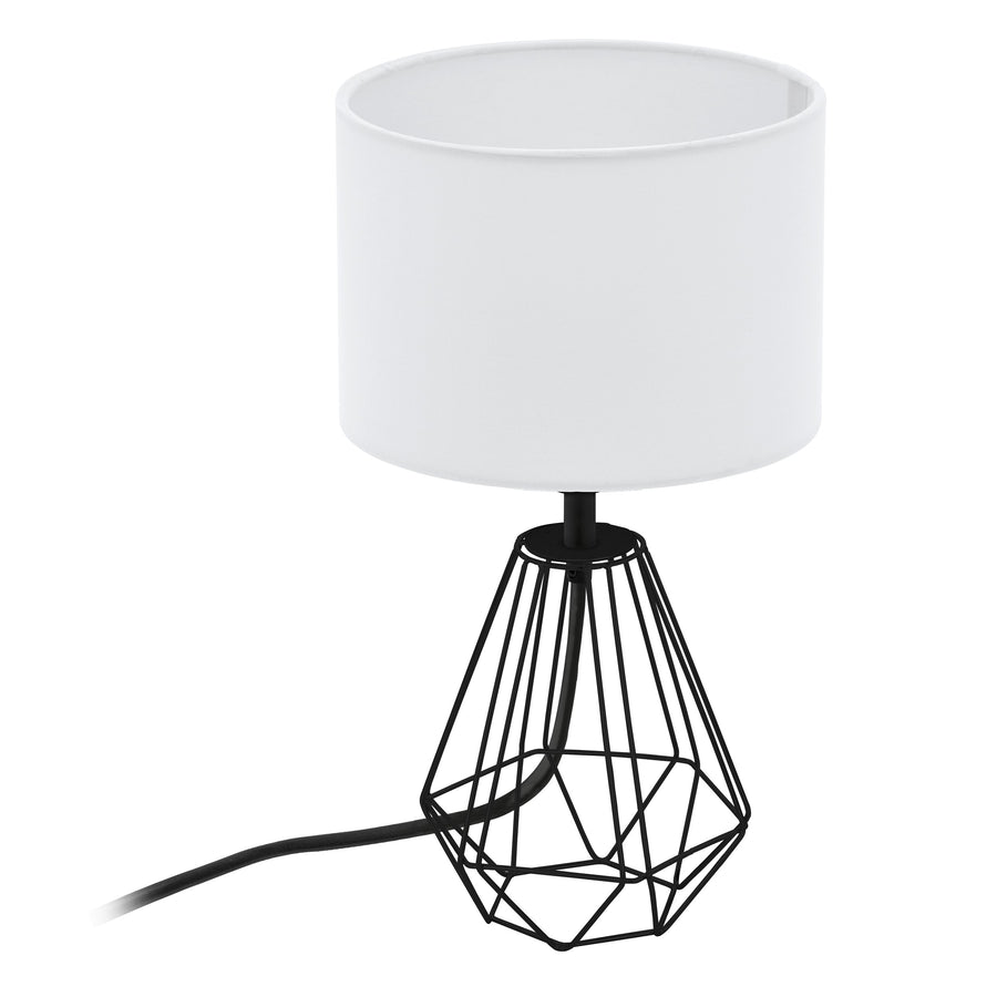 Vue plongeante du luminaire avec abat-jour blanc, pied noir ajouré et câble visible