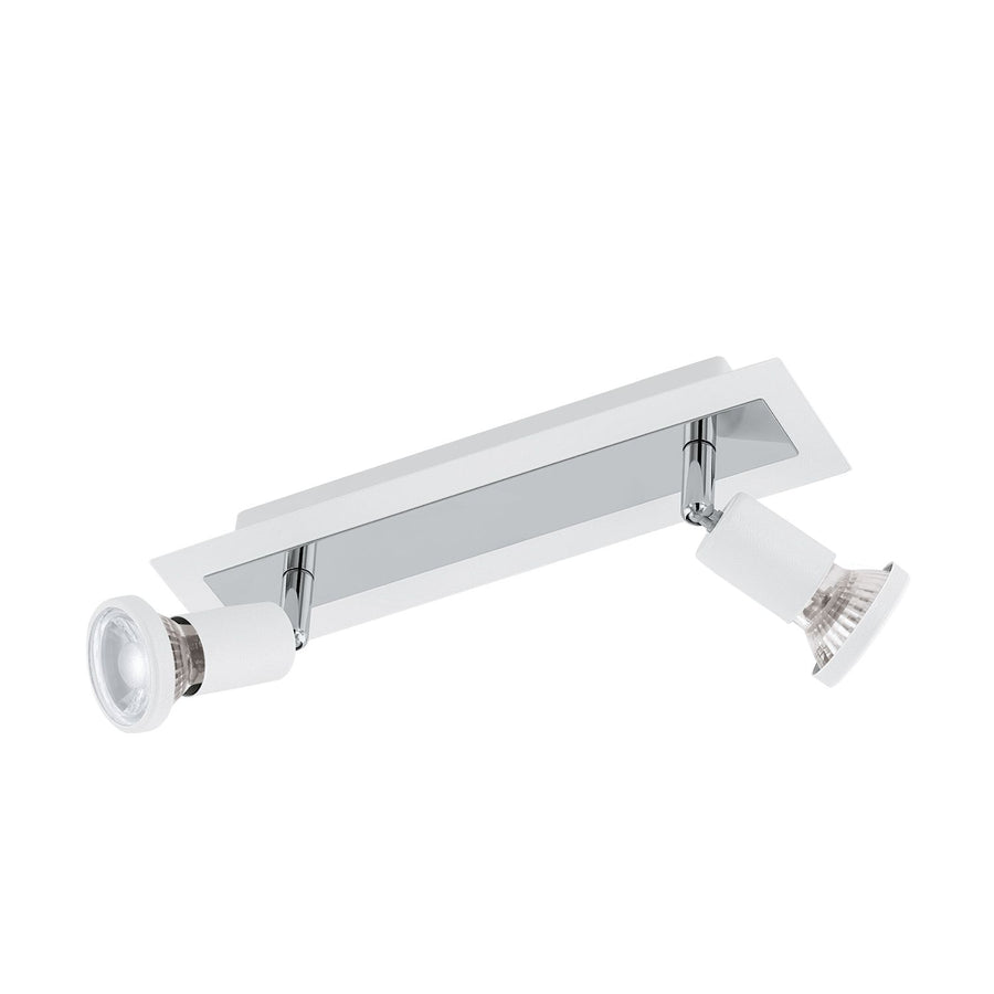 Luminaire blanc et chromé vu de trois quarts, deux spots orientables sur embase rectangulaire