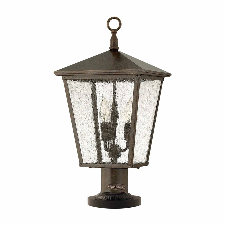 Même luminaire de face, cadre métallique foncé et trois ampoules visibles derrière le verre.