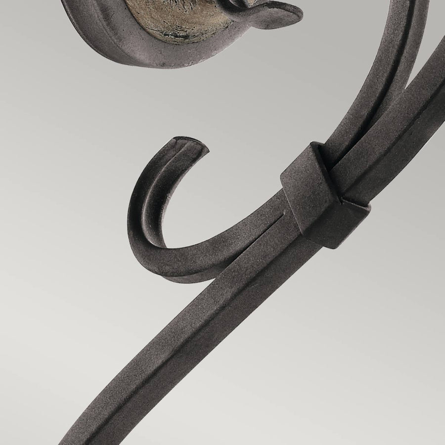 Détail du collier de fixation et de la volute inférieure du bras métallique