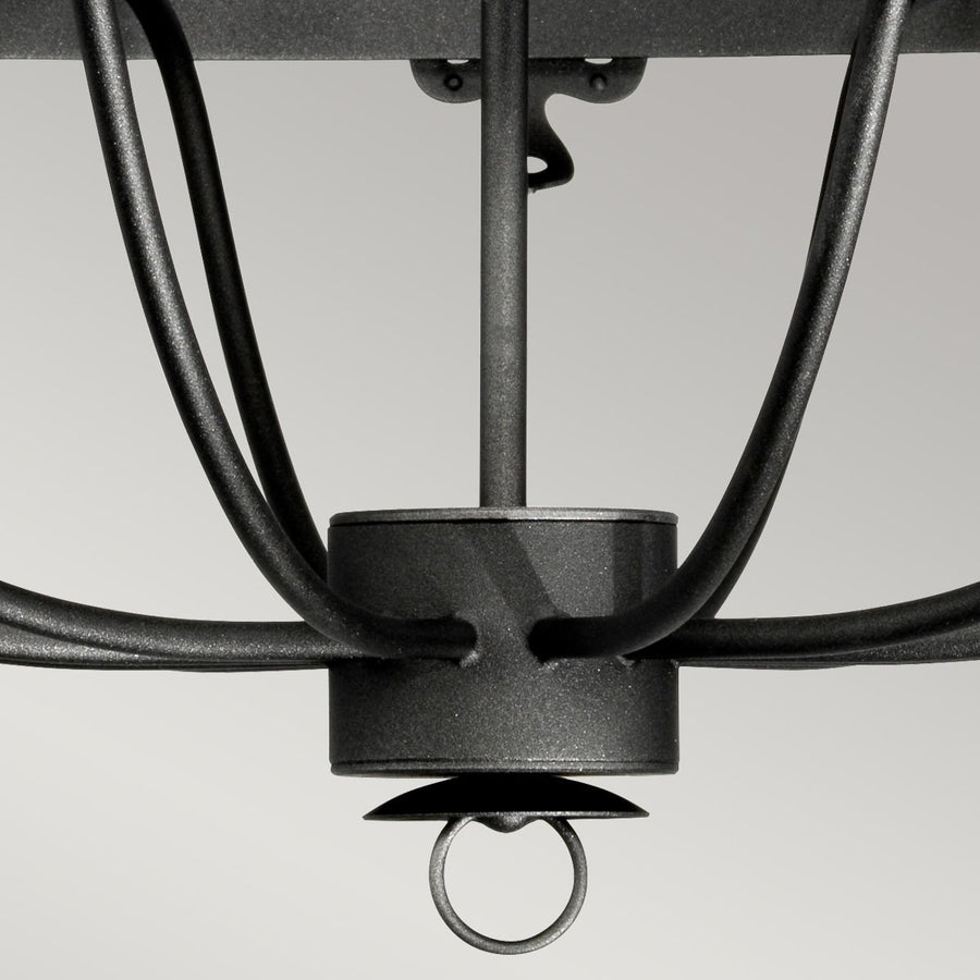 Détail du bas du luminaire, anneau terminal et croisement des bras incurvés