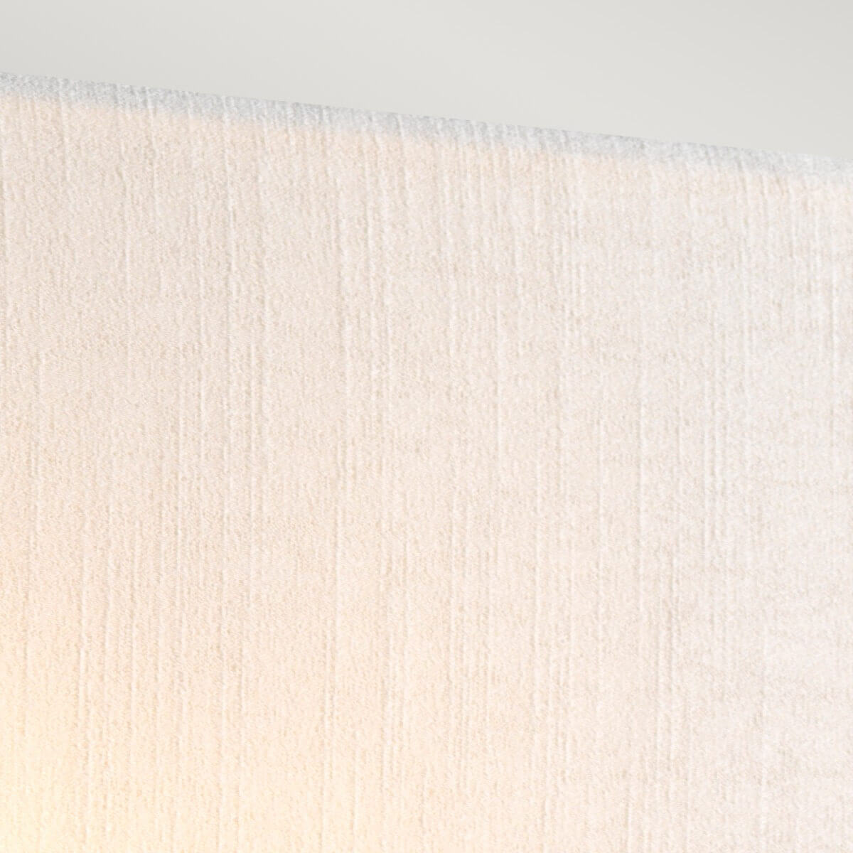 Détail de la surface textile éclairée par une lumière chaude et diffuse
