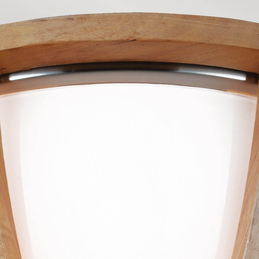 Vue rapprochée du diffuseur blanc inséré dans la structure en bois.