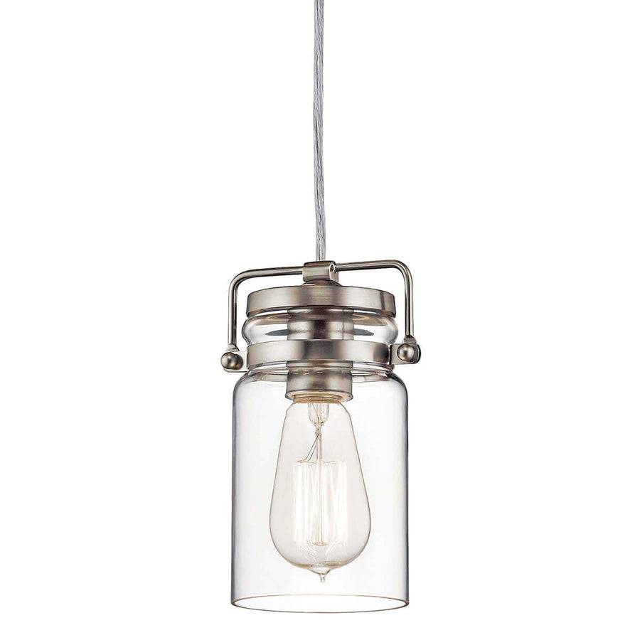 Vue rapprochée du luminaire avec ampoule visible dans le verre cylindrique.