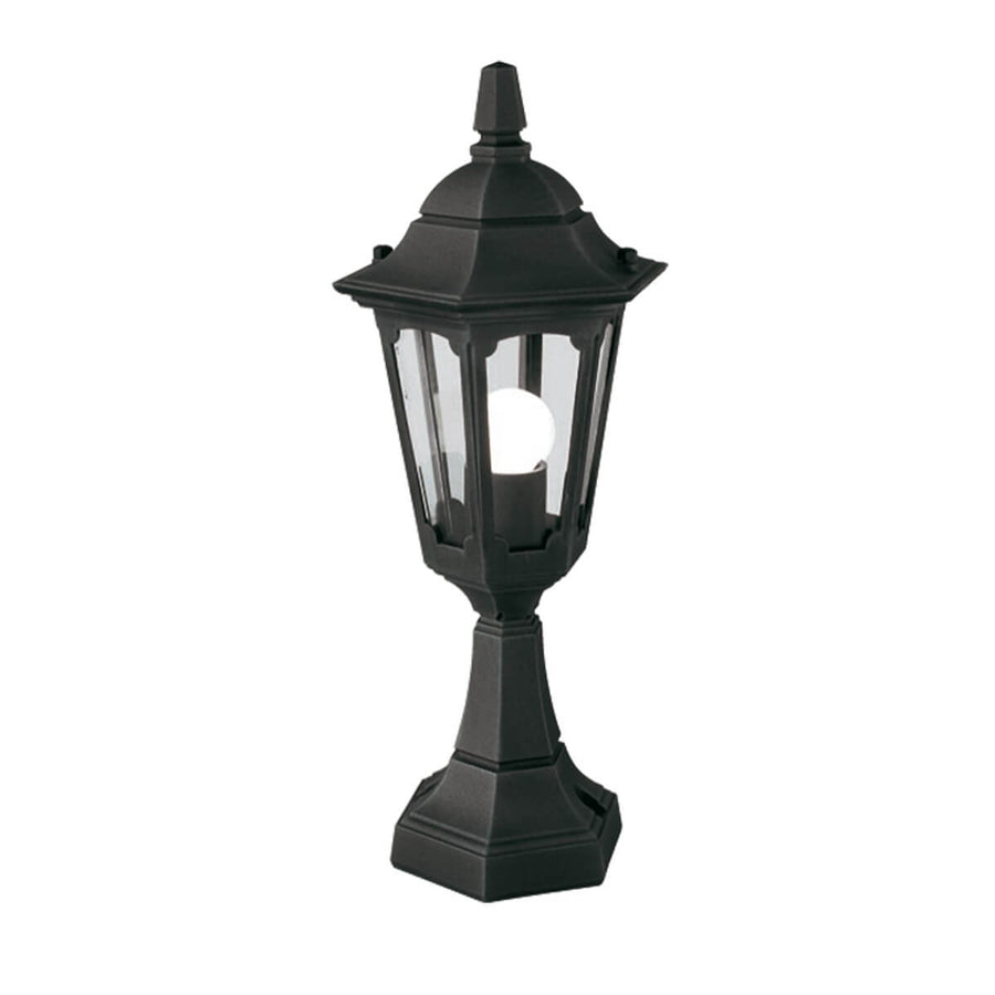Lampadaire extérieur noir de face sur fond blanc, ampoule allumée visible