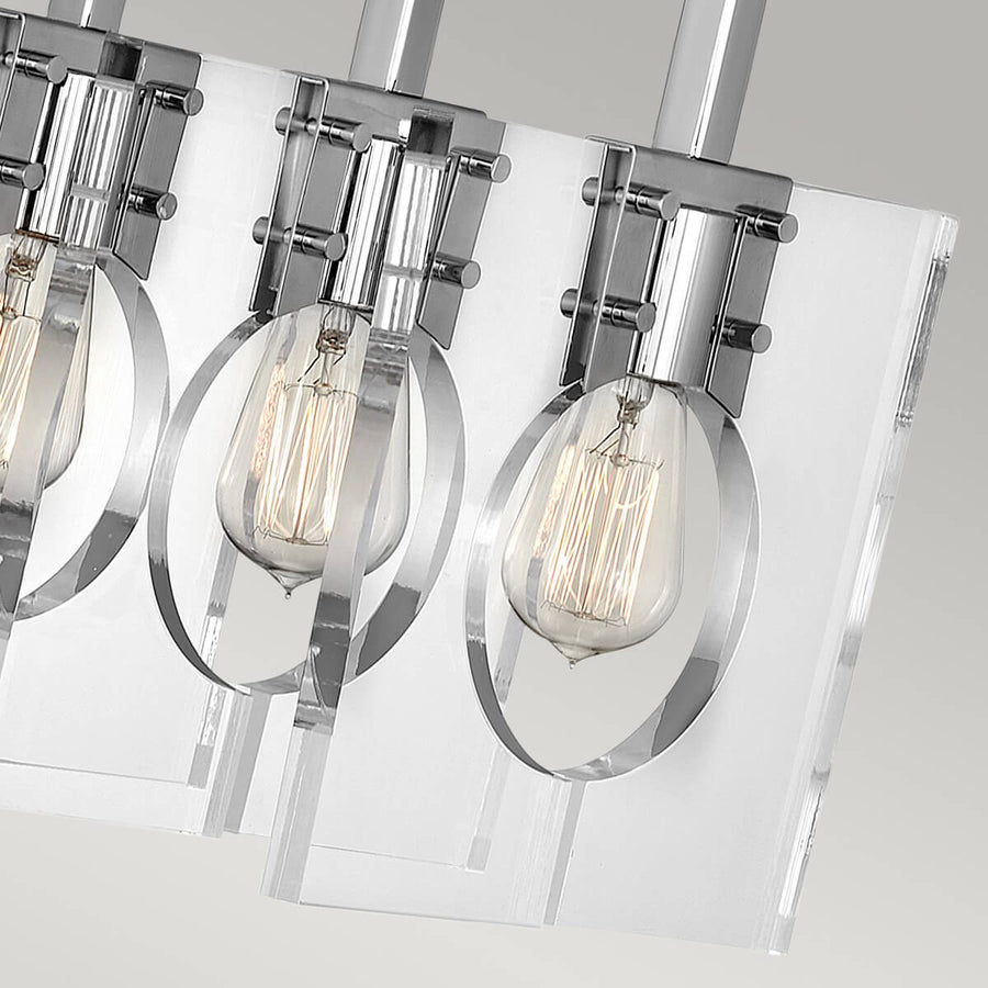 Gros plan des supports cerclés et des ampoules à filament sur verre transparent