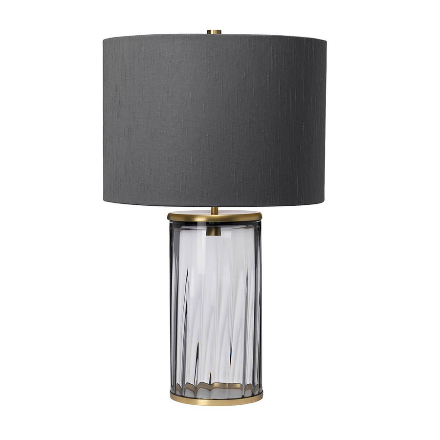 Vue de face de la lampe à poser avec abat-jour bleu foncé et socle en verre.