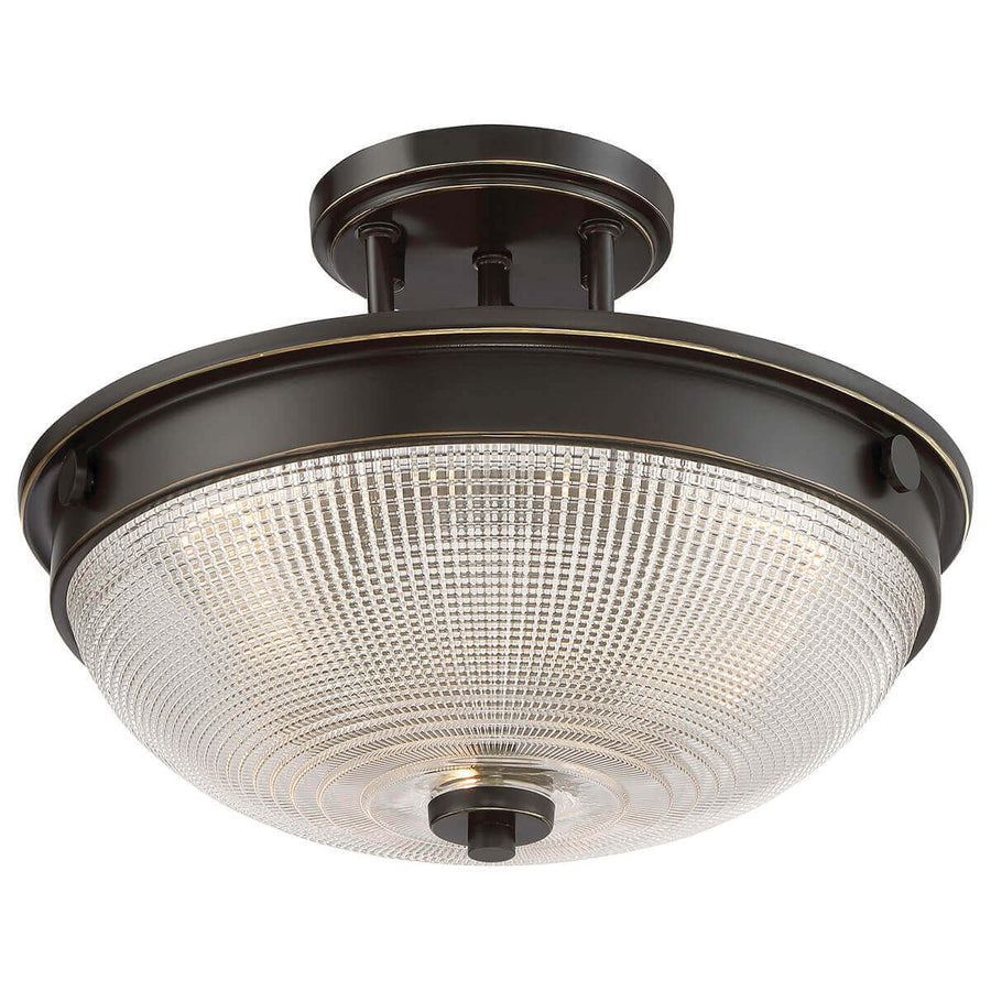 Autre angle du luminaire avec la bague bronze à liseré doré et le verre prismatique.