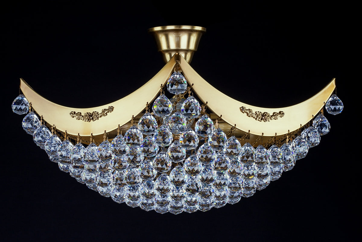 Plafonnier doré à deux arcs relevés, cascade de gouttes de cristal sur fond noir