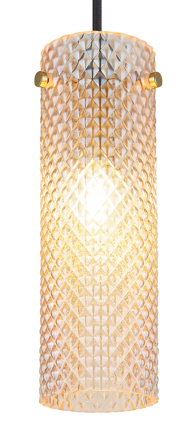 Détail rapproché du cylindre de verre diamanté éclairé, reflets dorés