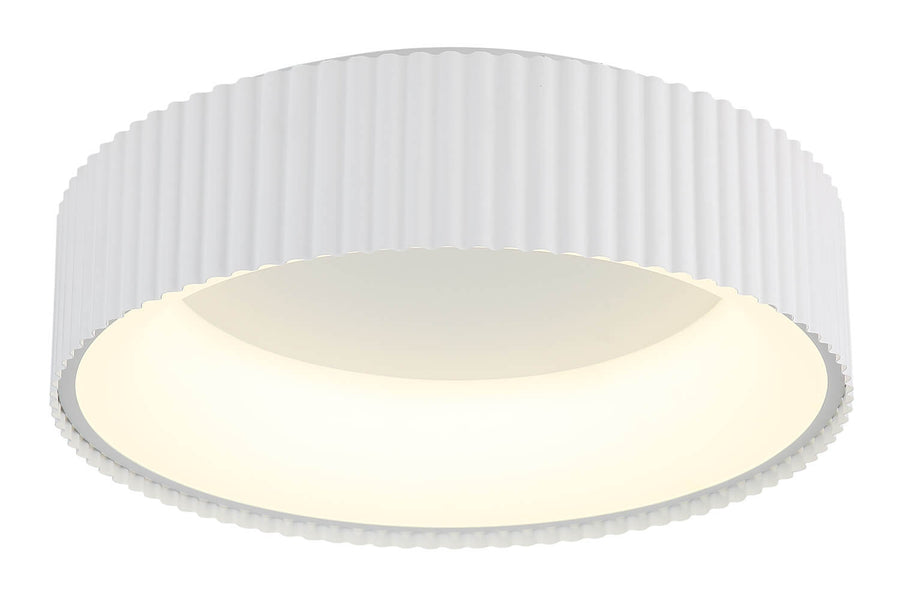 Gros plan en plongée montrant le diffuseur rond et la lumière chaude allumée.
