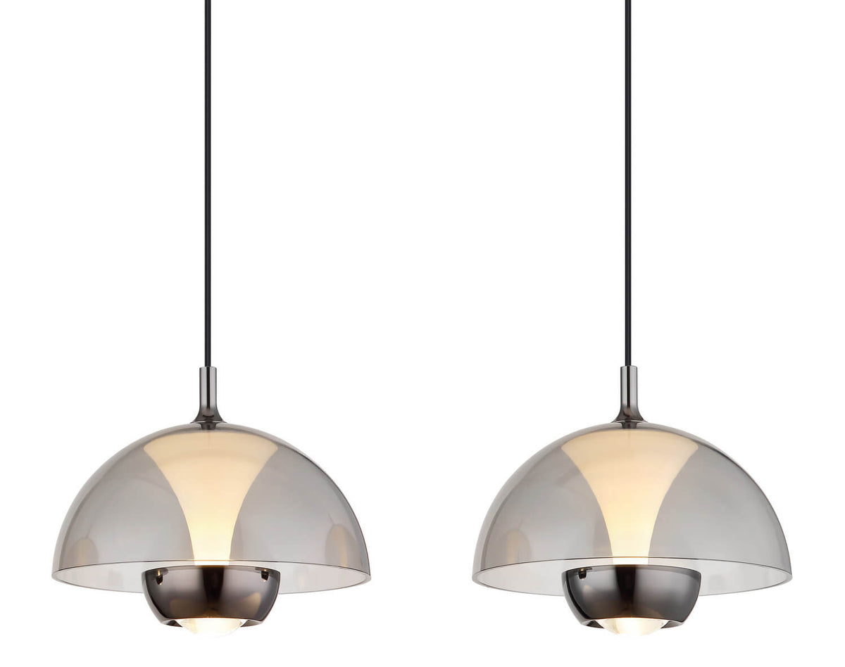Détail rapproché de deux dômes en verre fumé avec diffuseur central rétroéclairé