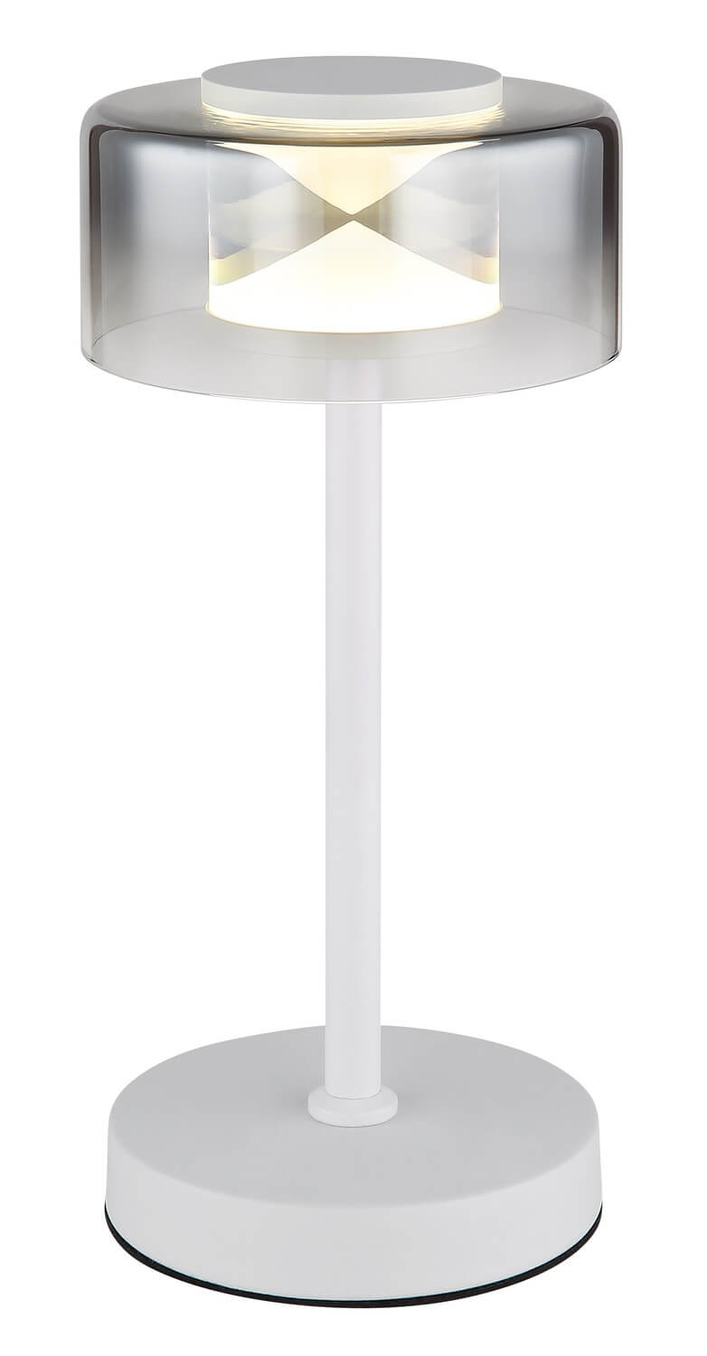 Vue rapprochée de l'abat-jour cylindrique transparent et de la lumière chaude.