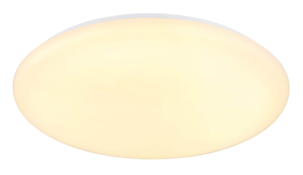 Vue rapprochée du grand diffuseur opalin bombé laissant filtrer une lumière chaude