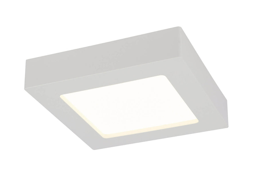 Autre angle du luminaire blanc carré, cadre biseauté et panneau LED allumé.